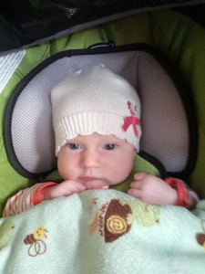Emily in her car seat